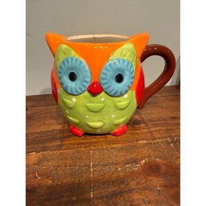 colorful ceramic owl utensil holder, also known as a utensil crock.